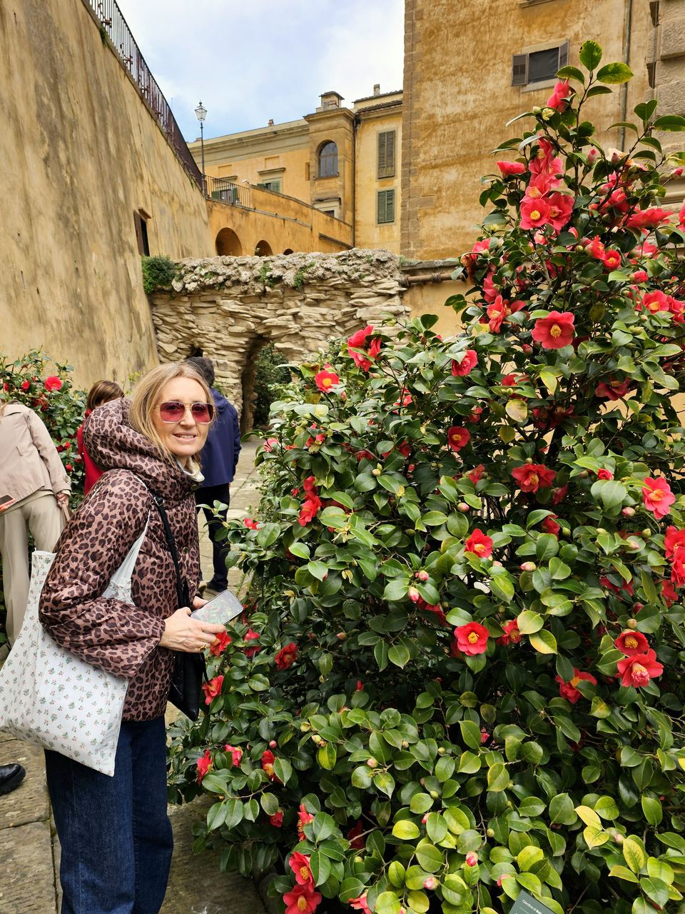 Monica, your host, in a red skirt on a street in central Florence