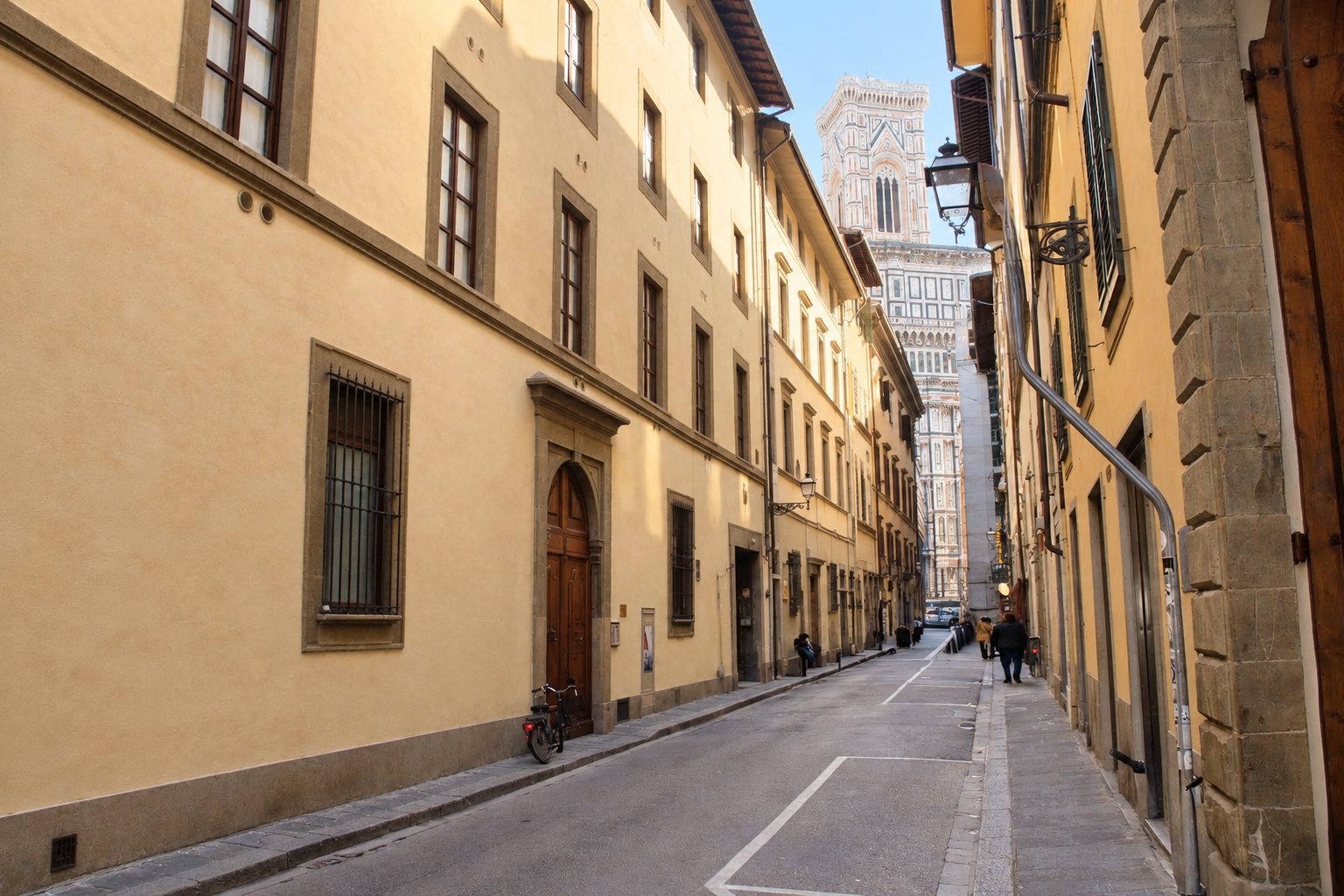 Via Ricasoli with its stone-framed doorways and Giotto's bell tower at the end of the street