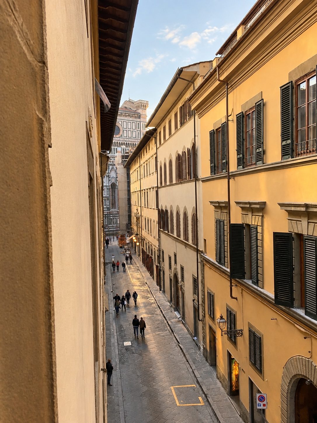 Via Ricasoli seen from a window of the building, looking down the street towards the Duomo