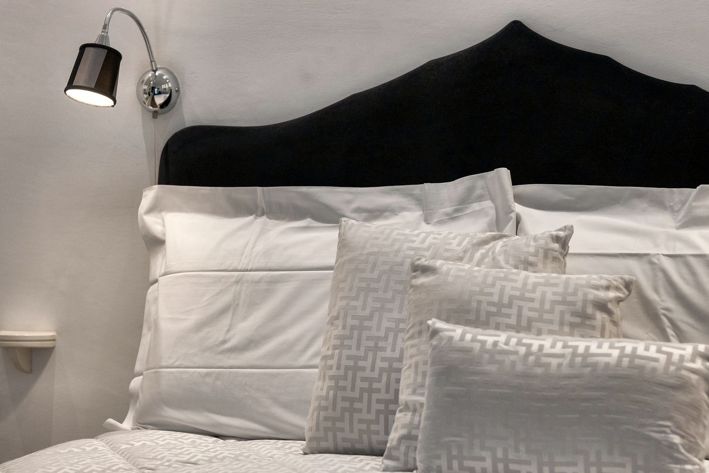 Velvet headboard and reading lights